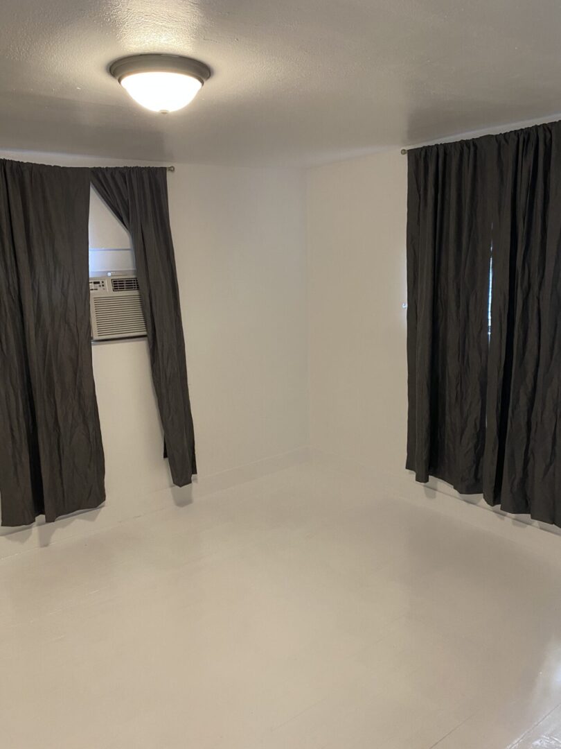 room with black curtain